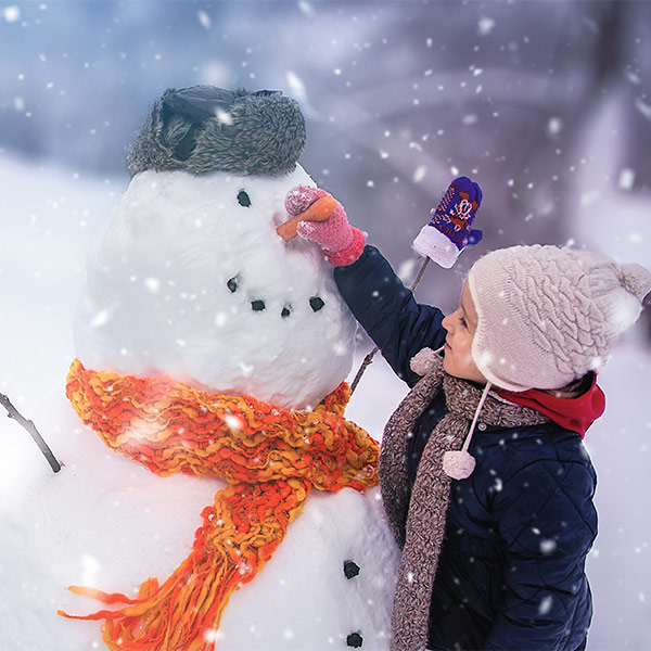 Boy making snowman Boy making snowman